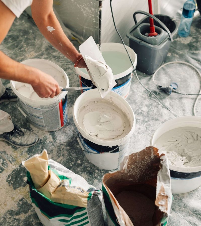 builder-s-hands-holding-trowel-and-spatula-a-work-2026-03-25-01-47-20-utc