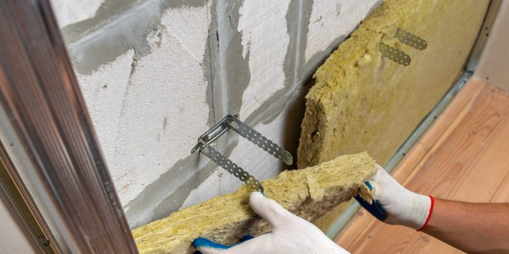 worker-insulating-a-room-wall-with-mineral-rock-wo-2026-03-17-05-08-11-utc